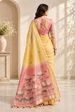 Elegant cotton saree featuring delicate floral motifs, woven border detailing, and a beautifully designed pallu with traditional tassel accents