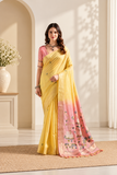 Elegant cotton saree featuring delicate floral motifs, woven border detailing, and a beautifully designed pallu with traditional tassel accents